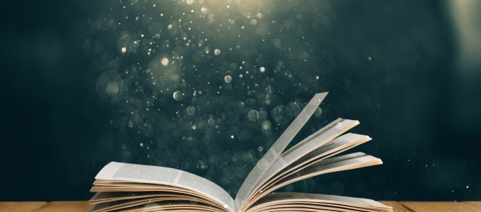 Open book on old wooden table